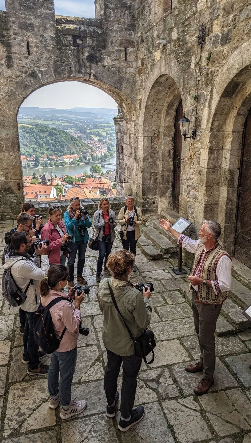 A family enjoying a picnic at a scenic overlook, showcasing the beauty of Slovakia's countryside.
